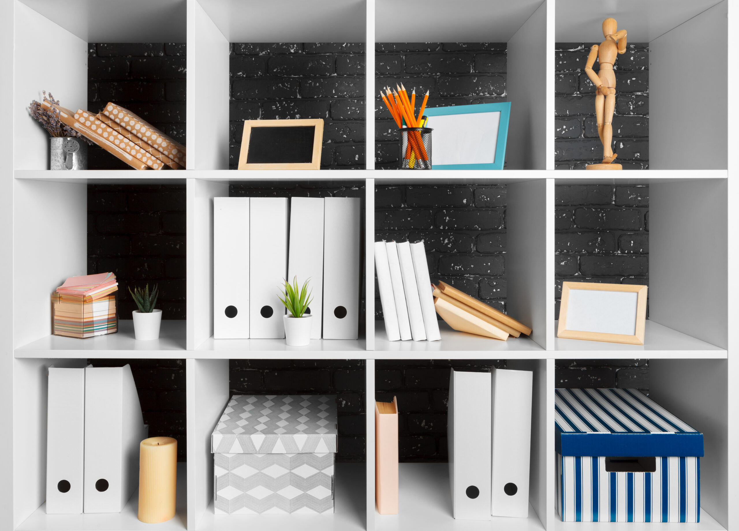 Home office working space. white shelf with accessories